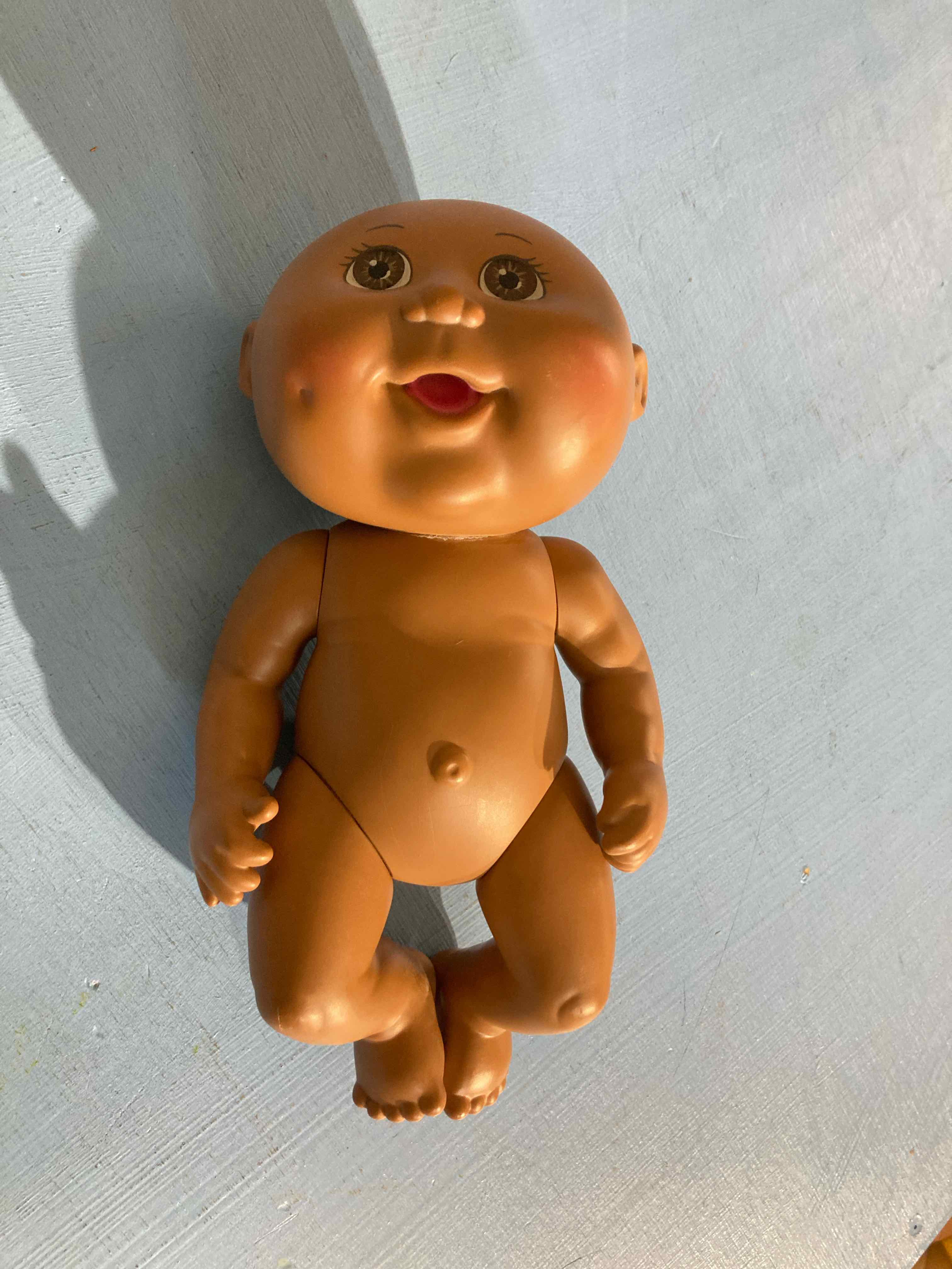 Tan Plastic Baby Doll